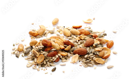 Healthy mix of salty and spicy peanuts, almonds, sunflowers, and pumpkin seeds, isolated on white background