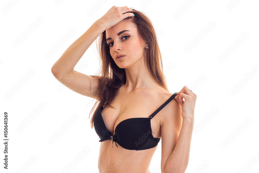 sexy young girl in black bra keeps head Stock Photo | Adobe Stock
