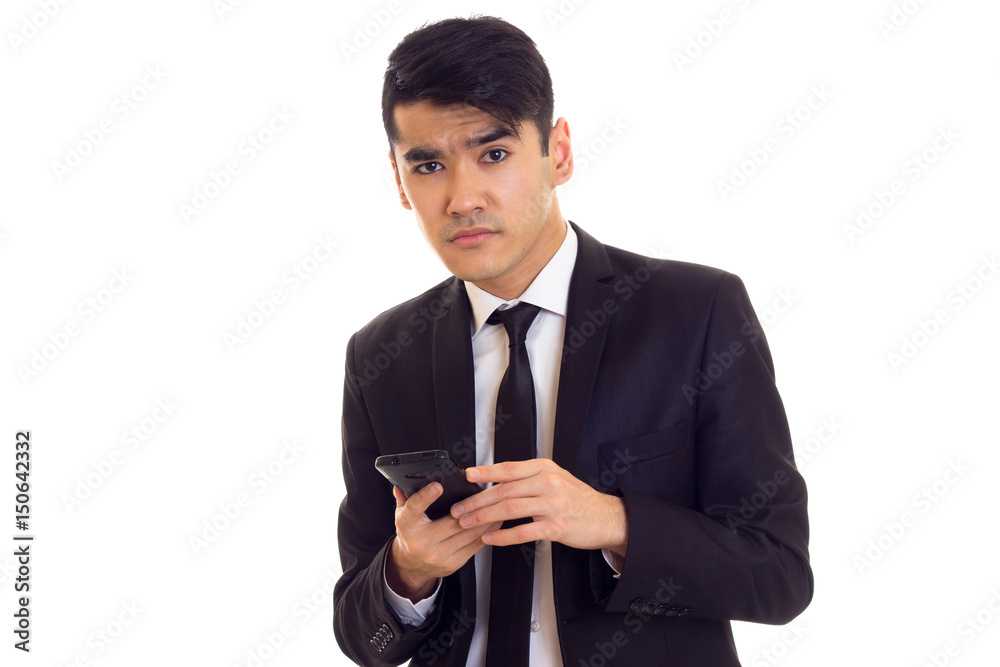 Young man in suit talking on the phone Young man in suit talking on the phone