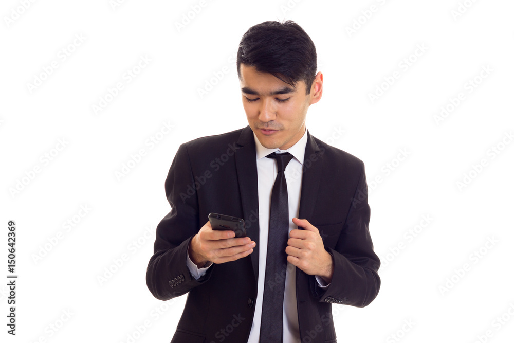 Young man in suit talking on the phone Young man in suit talking on the phone