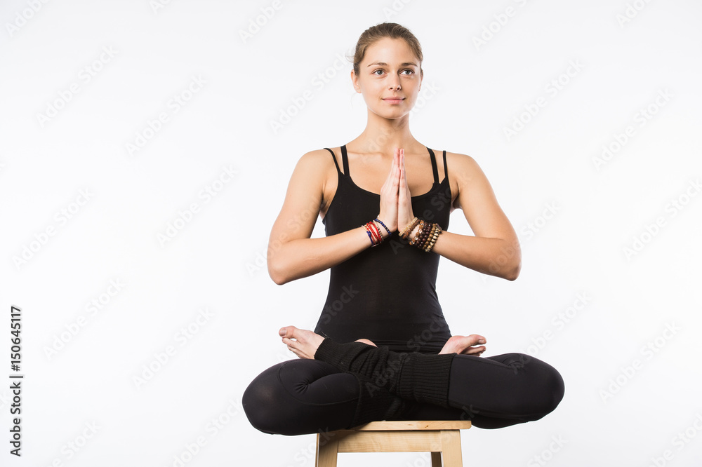 beautiful woman sit on a chair in meditative pose isolated on white beautiful woman sit on a chair in meditative pose isolated on white