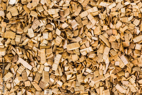 Background image of brown wood chips. Texture.