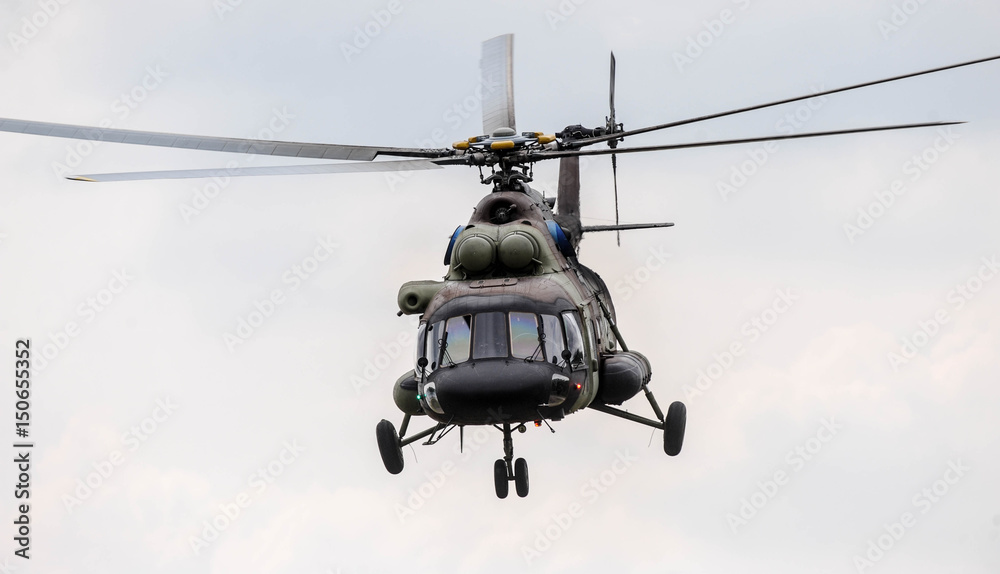 Army transport helicopter in low level flight Army transport helicopter in low level flight