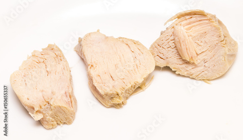 Obraz na płótnie Pieces of boiled chicken breast over white background w salonie