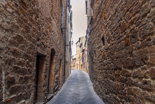 Fototapeta Naklejka Na Ścianę i Meble -   View of a street of the small and famous town of Volterra, Italy.