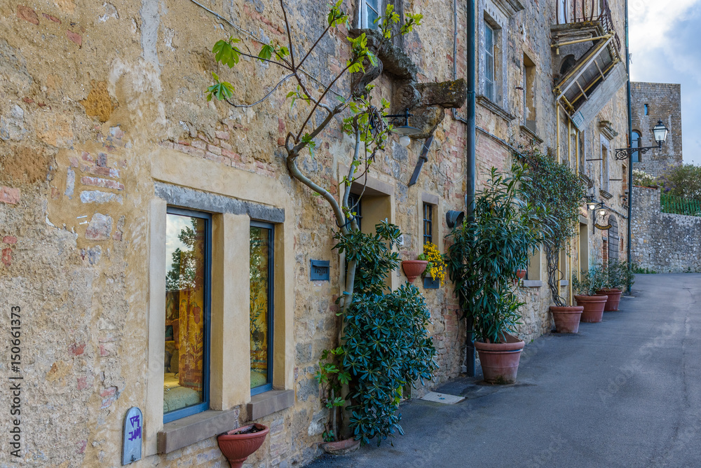  View of a street of the small and famous town of Volterra, Italy.