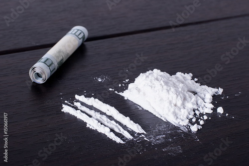 Cocaine divided into tracks on the table
