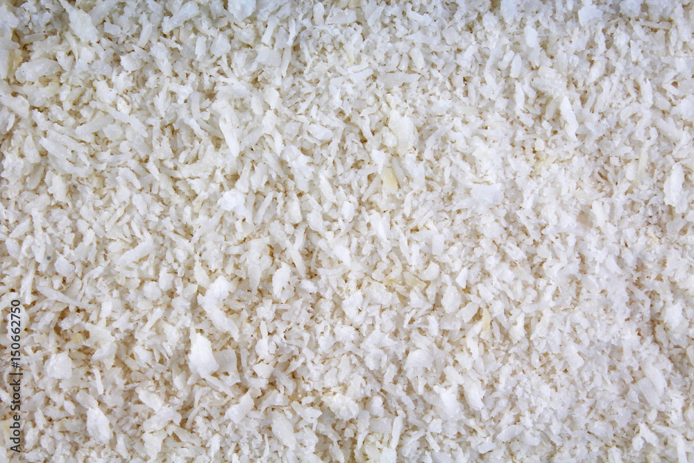 Desiccated coconut texture pattern background. Design wallpaper. Desiccated coconut texture pattern background. Design wallpaper.