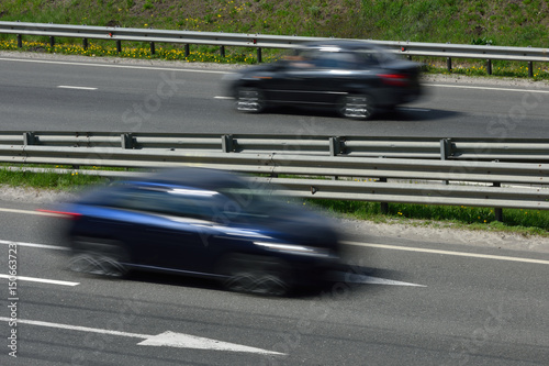 A cars at high speed rides along the road, blurred in motion © pridannikov