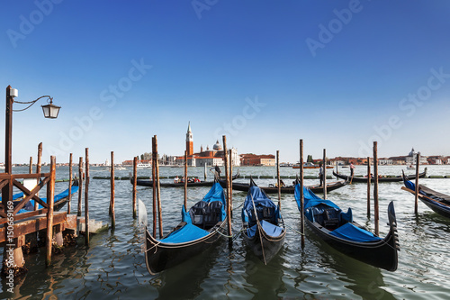 A view of the Cathedral of San Giorgio Maggiore, Venice lagoon and gondolas from the Piazza San Marco, Venice, Italy © vesta48