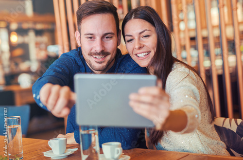Young couple drinking coffee in a cafe. Dating, relationships, love, romance, lifestyle