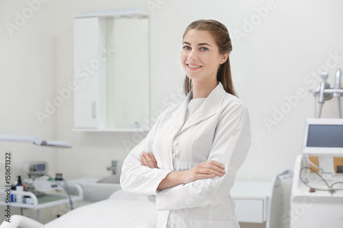 Young beautiful doctor in dermatology clinic photo