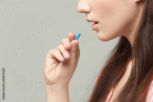 Beautiful young woman takin...