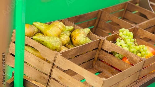 Girl puts pears in boxes. photo