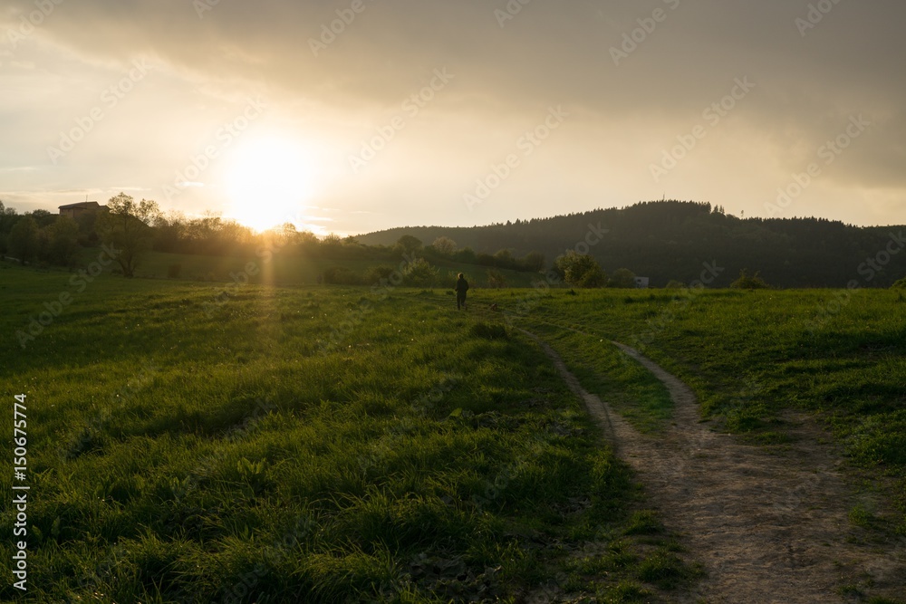 Runner on meadow during sunset. Slovakia