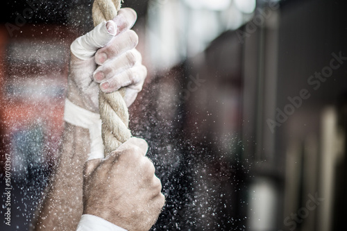 man holding crossfit rope