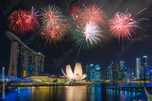 Canvas Print Singapore city skyline at night with beautiful night light with celebration fireworks