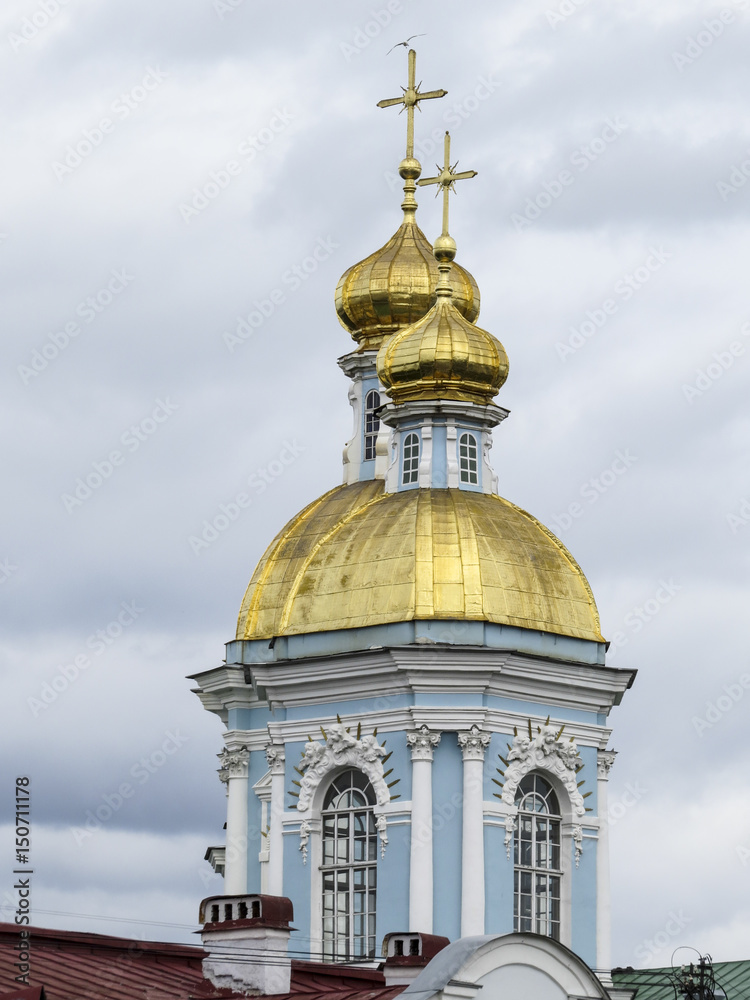 Saint Petersburg,  Russia - 13 August 2016:  Detail of St. Nicholas Naval Cathedral in the background of cloudy sky.