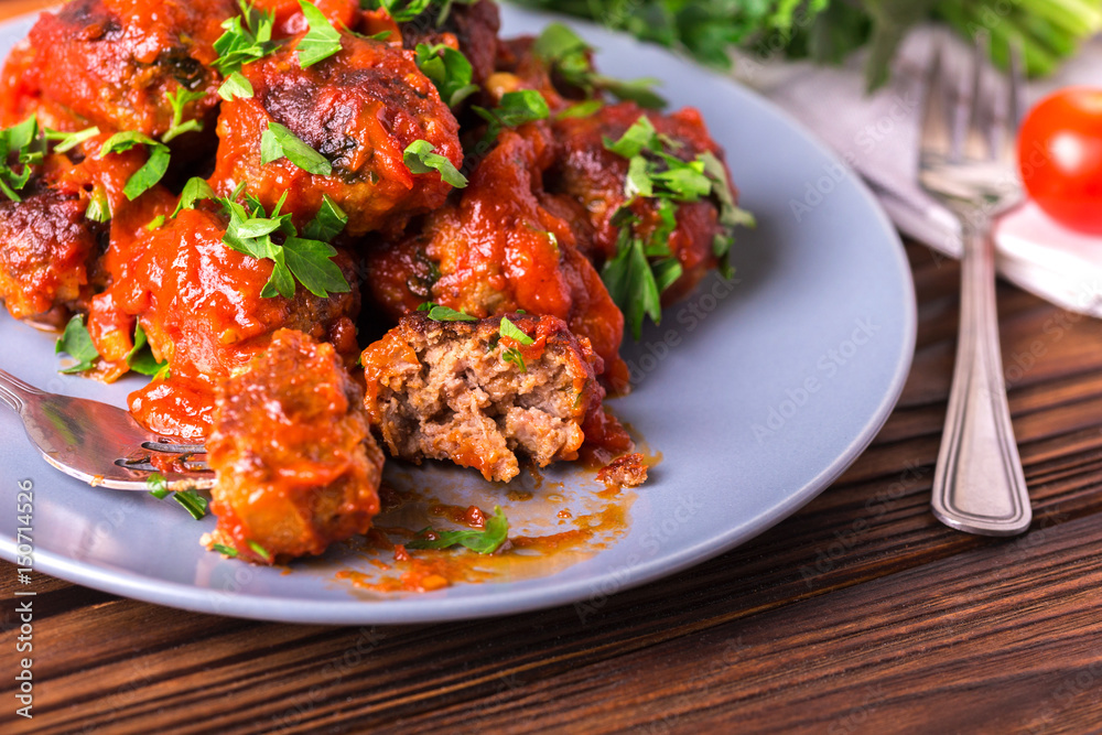 Traditional Italian beef meatballs, tomato sauce and parsley