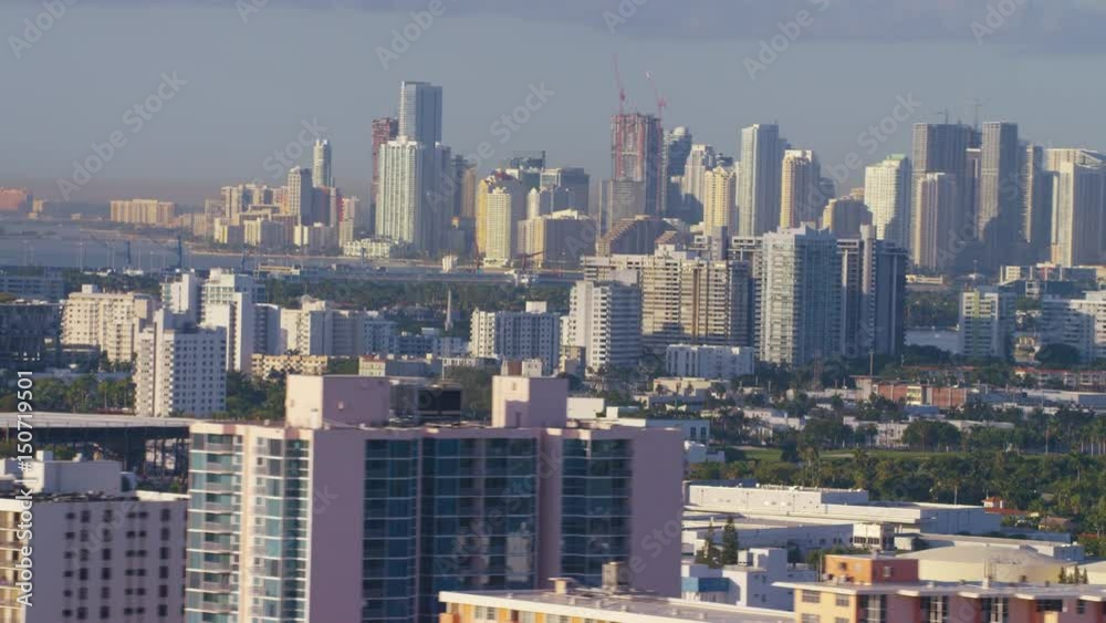 Aerial view of Miami Beach hotels in foreground with Miami, Florida in background Aerial view of Miami Beach hotels in foreground with Miami, Florida in background