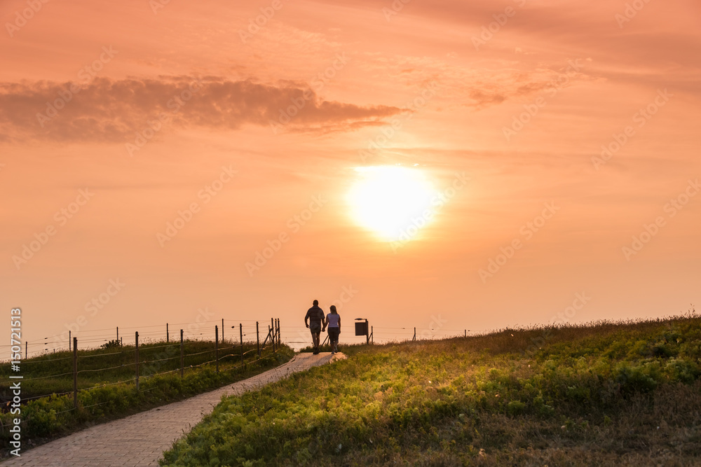 Couple walking together at sunset, Helgoland island