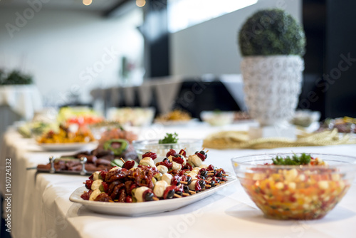 Variety of fresh salads bowls on buffet table business dinner