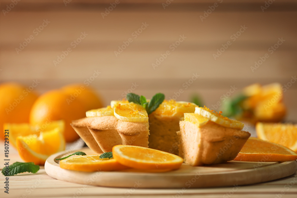 Delicious citrus cake on cutting board Delicious citrus cake on cutting board