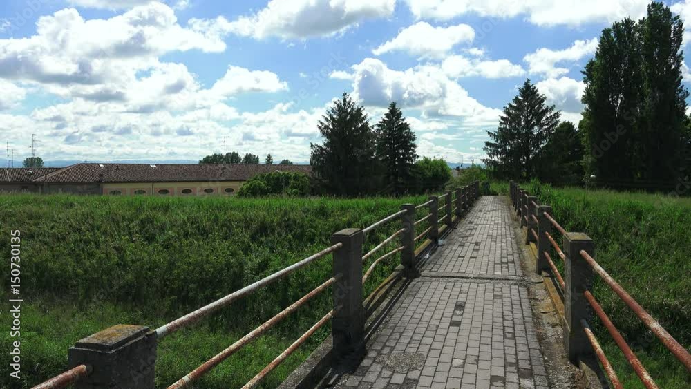 narrow footbridge in Italian countryside narrow footbridge in Italian countryside