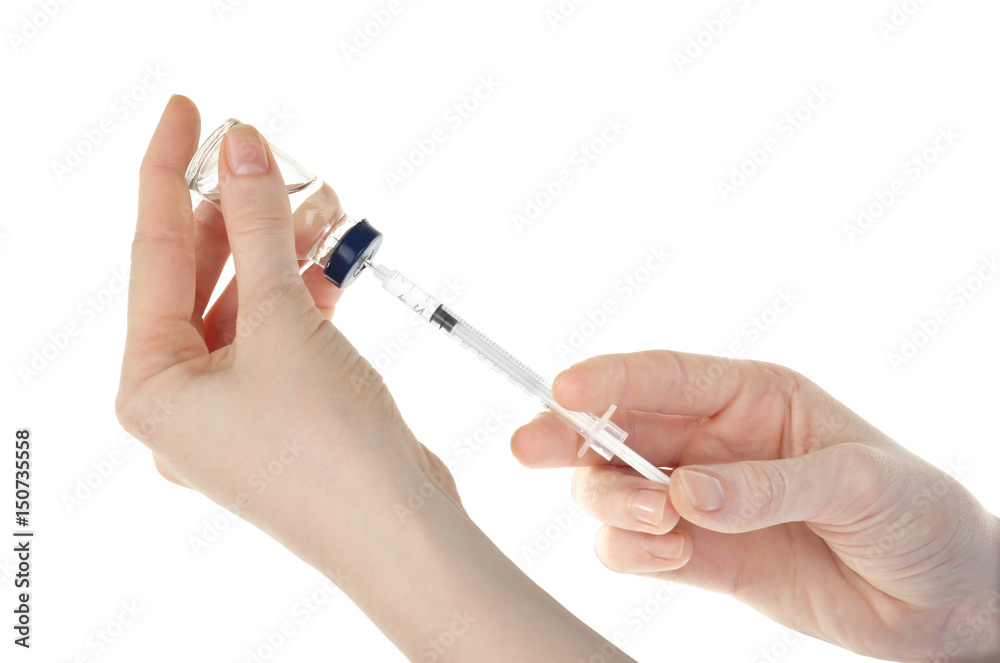 Hands of nurse with syringe and medicine for vaccination on white background Hands of nurse with syringe and medicine for vaccination on white background
