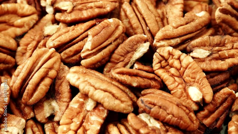 Food background. Pecan nuts close up. Dieting concept. Dolly slider shot 4K ProRes HQ codec Food background. Pecan nuts close up. Dieting concept. Dolly slider shot 4K ProRes HQ codec
