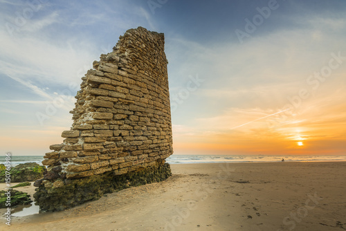 Canvas Print Torre del Loro Roman tower ruins on beach in Mazagon,Spain