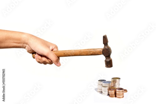 Raise the Hammer to smash coin stack isolated on white background,Hammered down,Business and finance