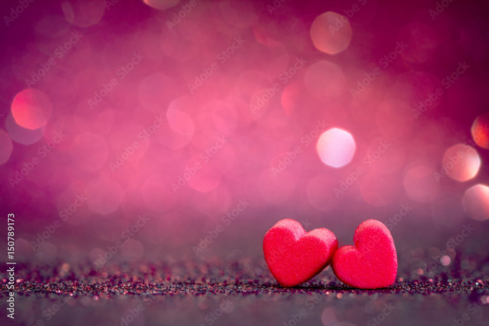 red Heart shapes on abstract light glitter background in love concept for valentines day with sweet and romantic moment