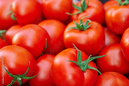 A pile of red tomatoes. .(selective focus) © evafesenuk