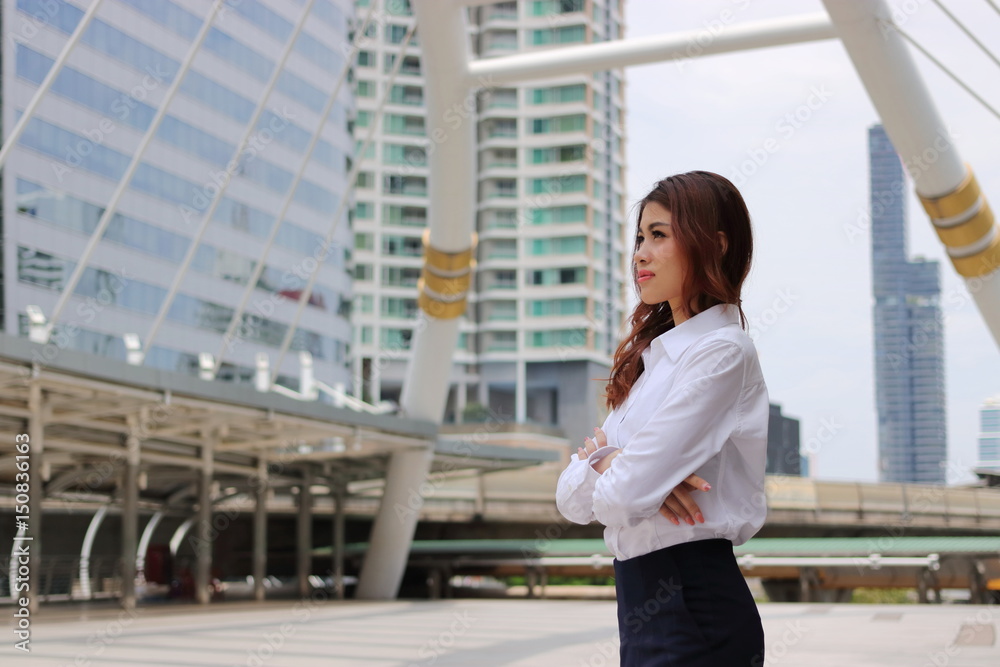 Portrait of business woman leader looking far away at outdoor public Portrait of business woman leader looking far away at outdoor public