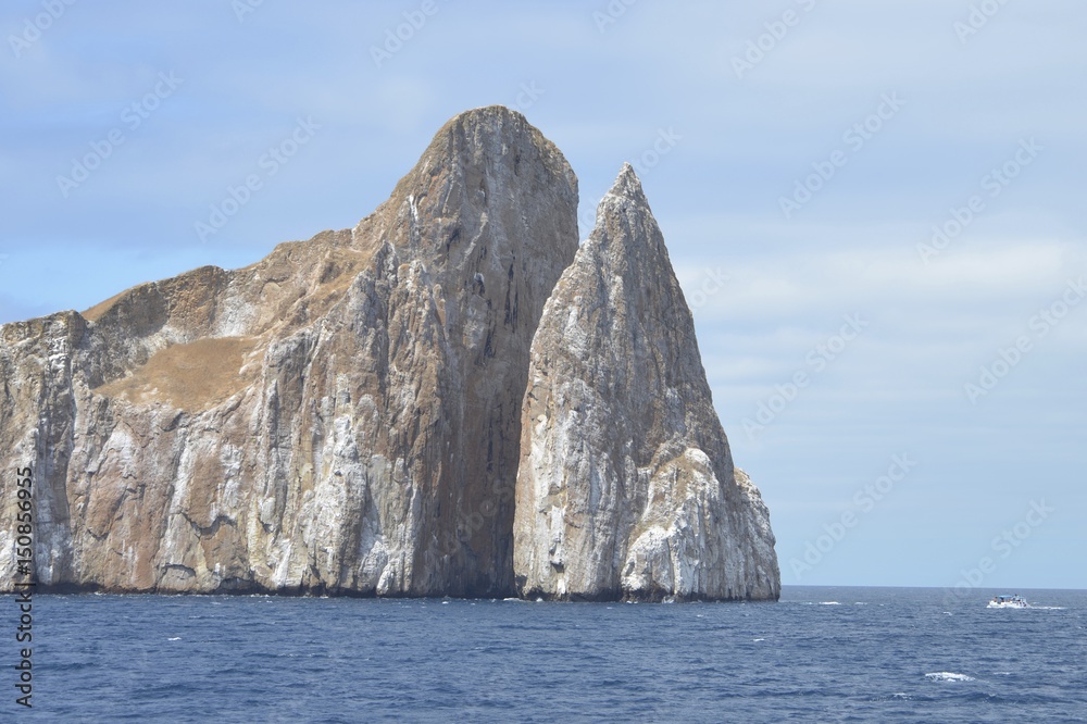 Kicker Rock (Leon Dormido), a striking volcanic rock formation off San Cristobal in the Galapagos Islands, Ecuador Kicker Rock (Leon Dormido), a striking volcanic rock formation off San Cristobal in the Galapagos Islands, Ecuador
