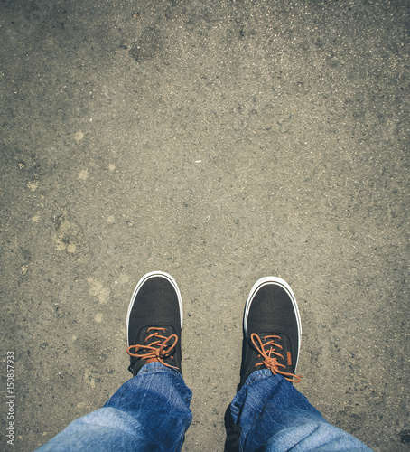 Top view from Young man with sneakers and jeans