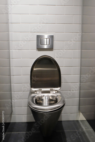 metal lavatory pan  in a public toilet photo