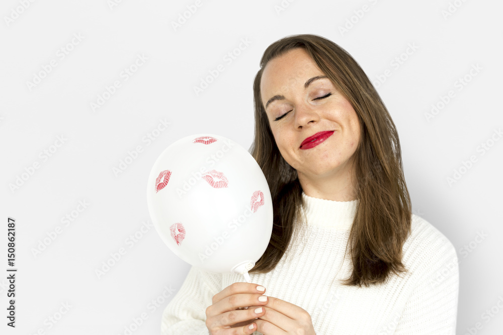 Young girl smiling holding a balloon Young girl smiling holding a balloon