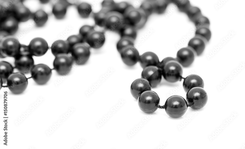 Black beads on a white background Black beads on a white background