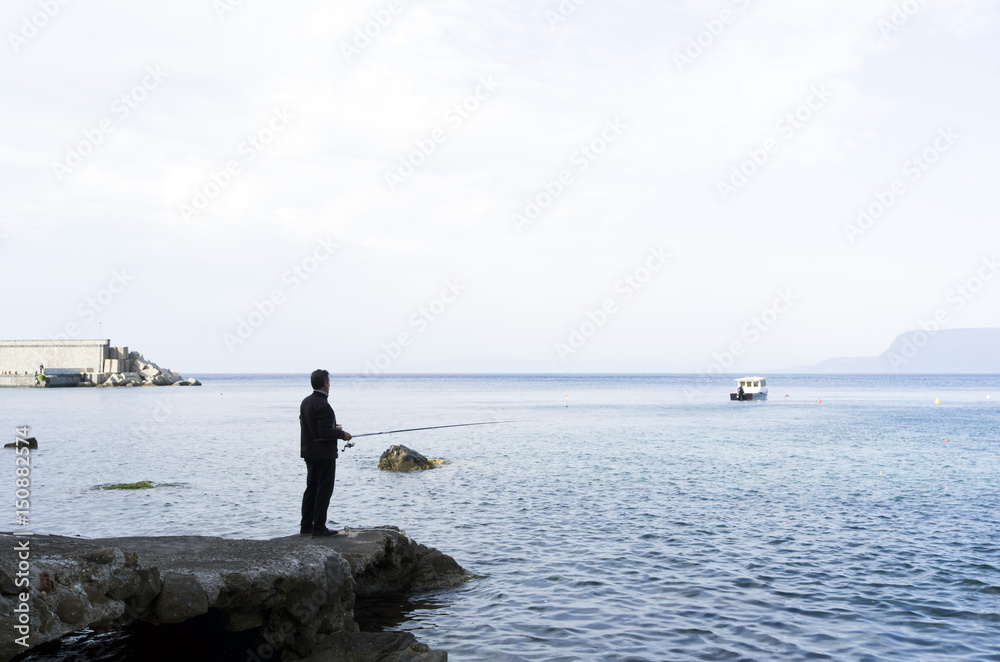 fisherman. Scilla, Calabria, Italy