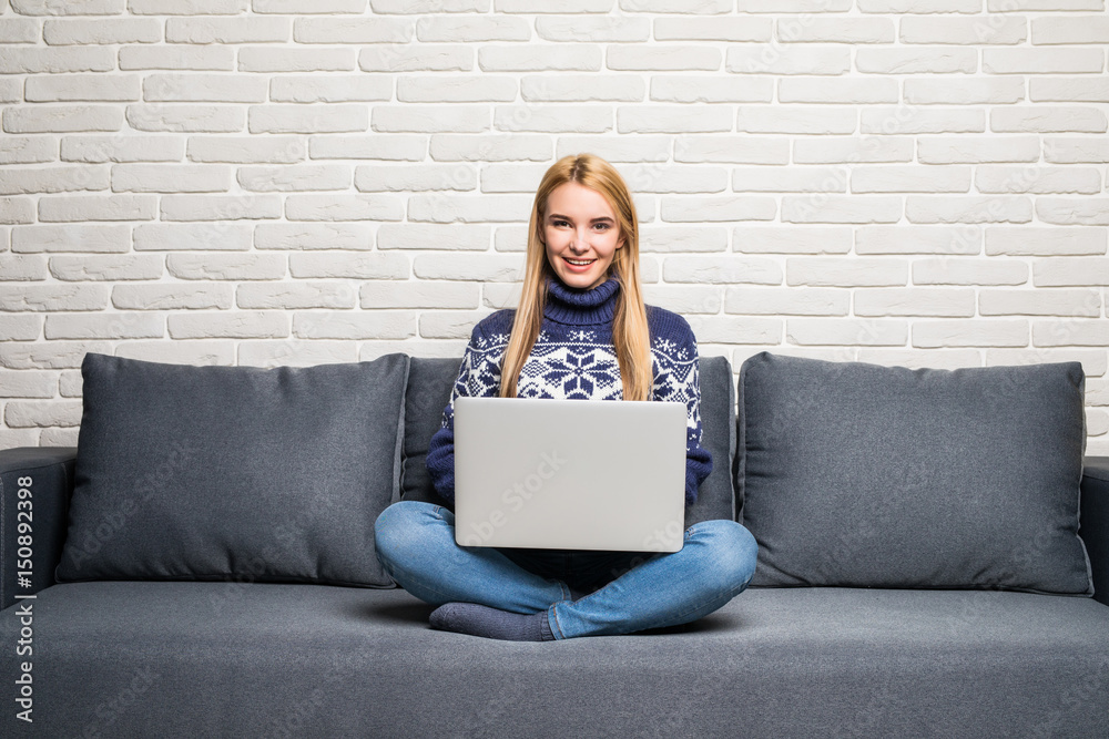 young woman using a laptop computer at home young woman using a laptop computer at home