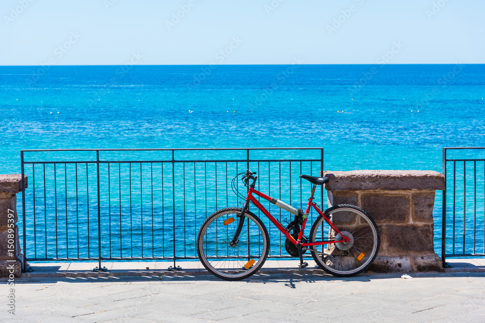 Fototapeta premium Old mountain bike by the sea in Alghero