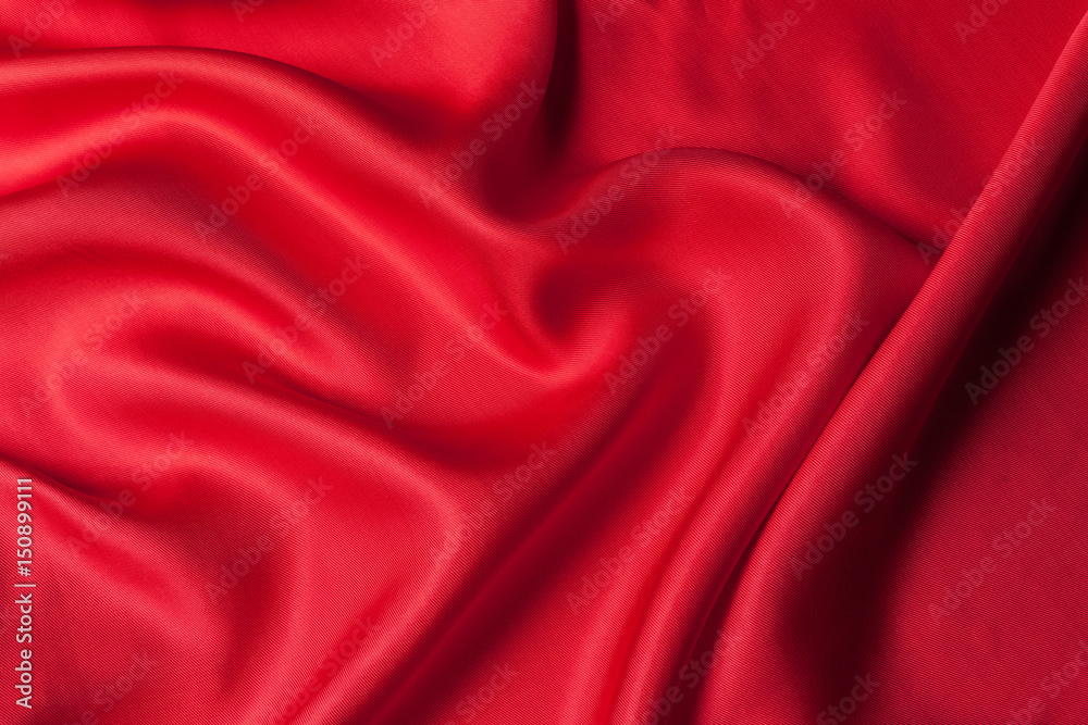 Fototapeta premium Red cloth waves background texture