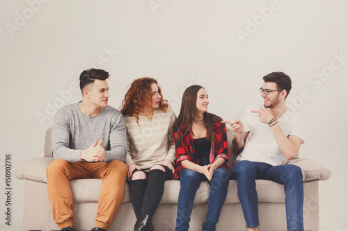 Fototapeta Naklejka Na Ścianę i Meble -  Party with friends, young people sitting on couch