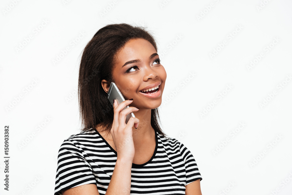 Happy young african lady talking by phone. Happy young african lady talking by phone.