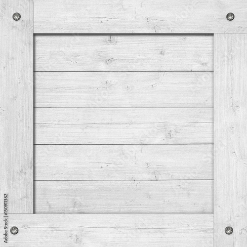 Side of white wooden crate, box, wall or frame with screws