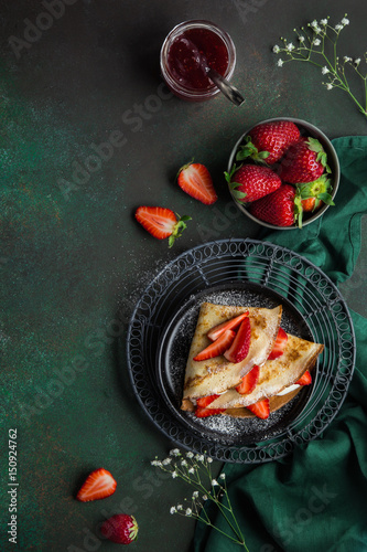 crepes with cream cheese and fresh strawberry, top view