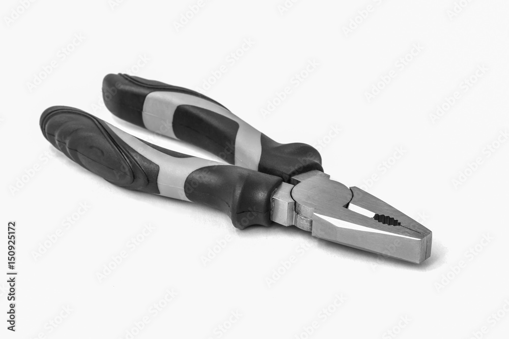 Black and red metal pliers isolated on white Black and red metal pliers isolated on white