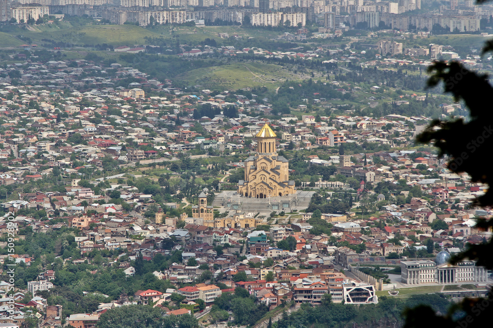 The Holy Trinity Cathedral of Tbilisi, Georgia. View from the high Mtatsminda park. Texture of the city, only roofs